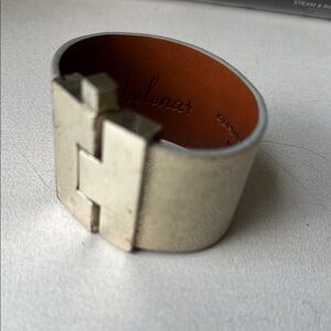 Leighelena Silver clasp metallic gold leather bracelet.